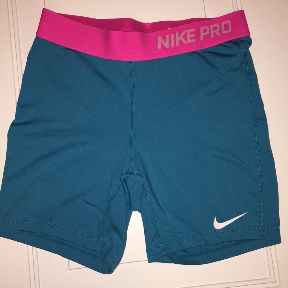 Blue and pink Nike pro compression shorts